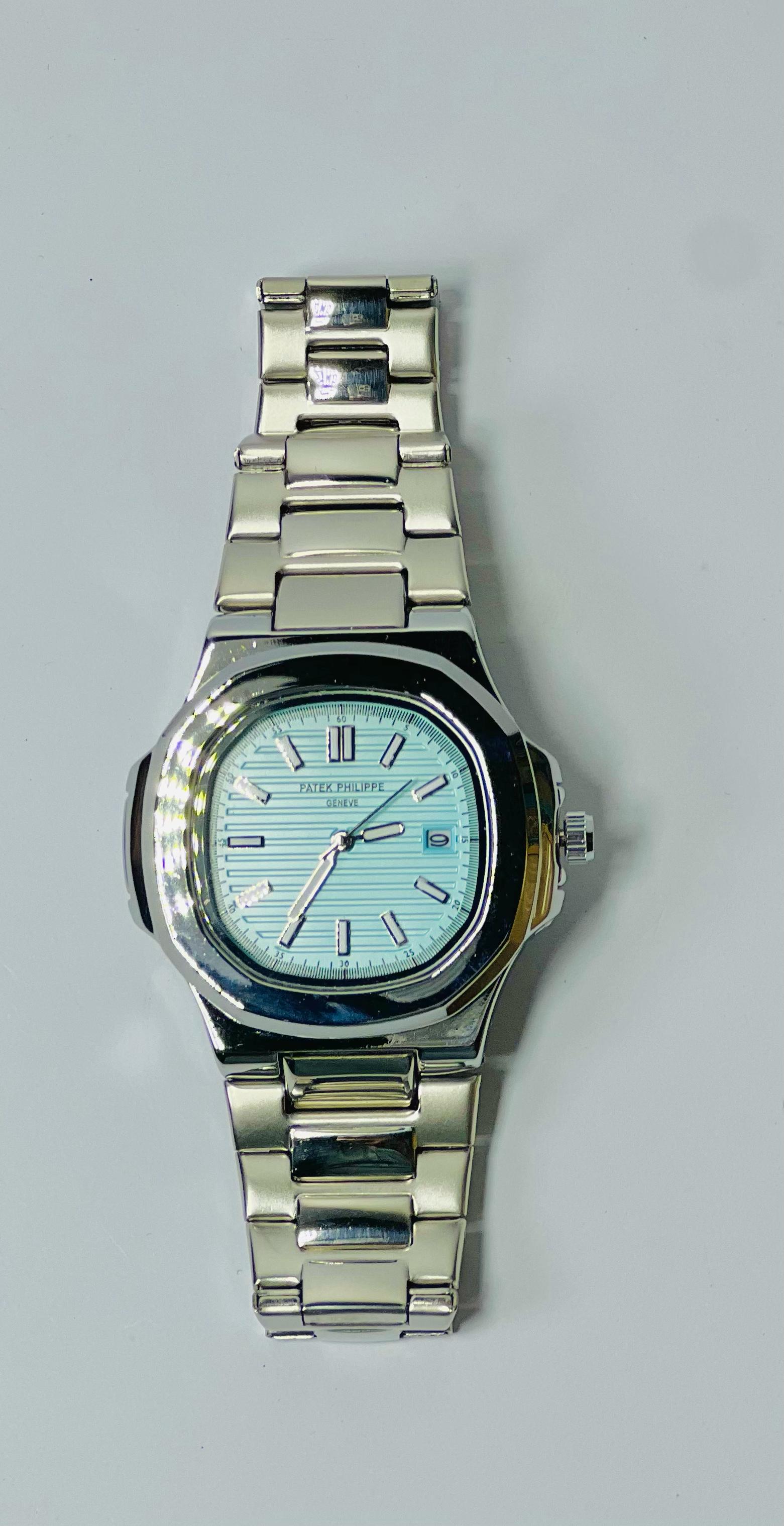 Patek Philippe Nautilus Silver Blue Dial – Luxury Timepiece